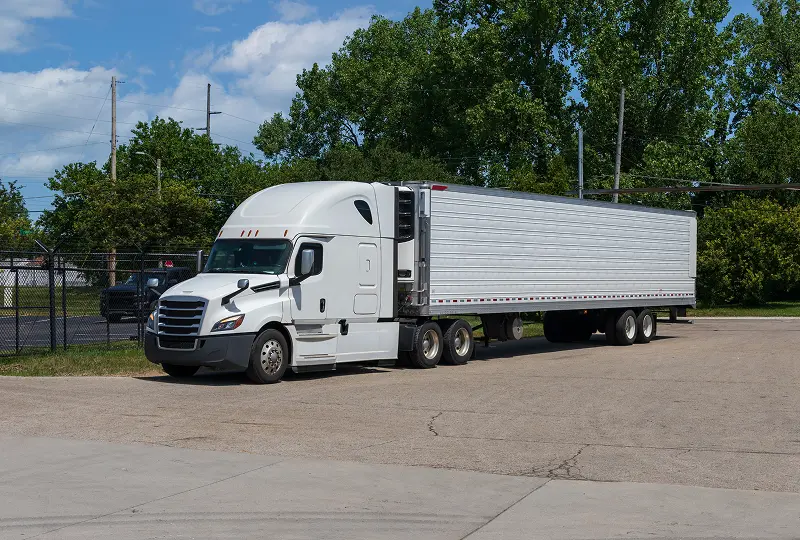 GettyImages-1316146871 White semi-truck parked in lot.